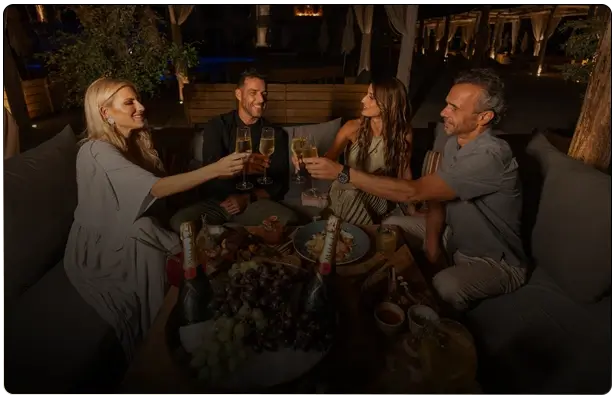 Group of friends celebrating at Taboo Restaurant in Cabo