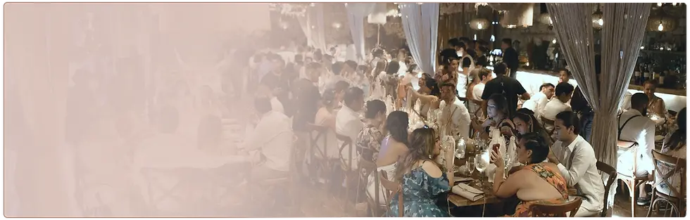 Guests dining at an outdoor wedding reception in Tulum