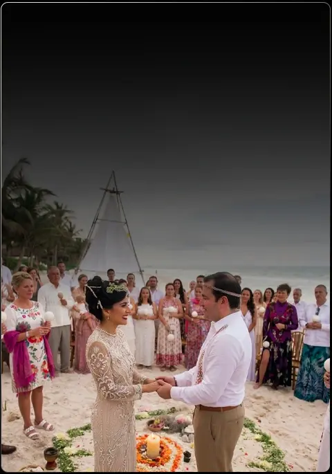 Couple at a beach wedding ceremony in Tulum