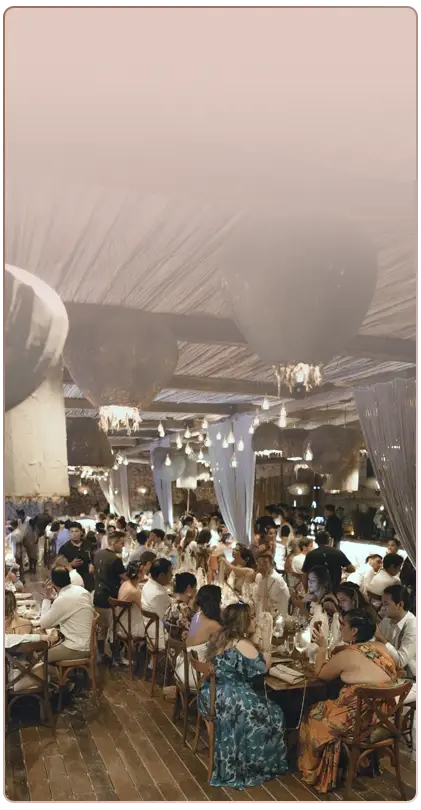 Guests at an elegant wedding banquet in Tulum