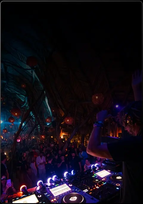 DJ performing live during a Grupos Tulum event
