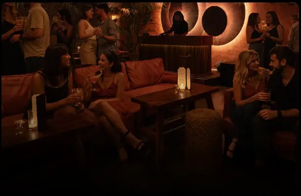 People enjoying the sophisticated atmosphere of Amante Speakeasy in Cabo
