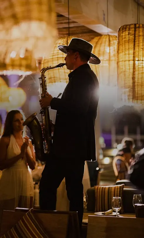 Saxophonist performing live at an elegant evening event